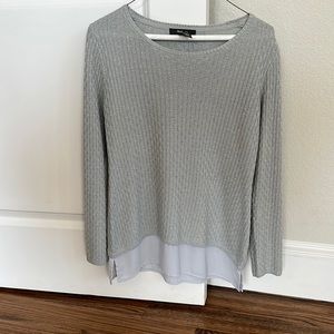 Sweater with layered shirt tale